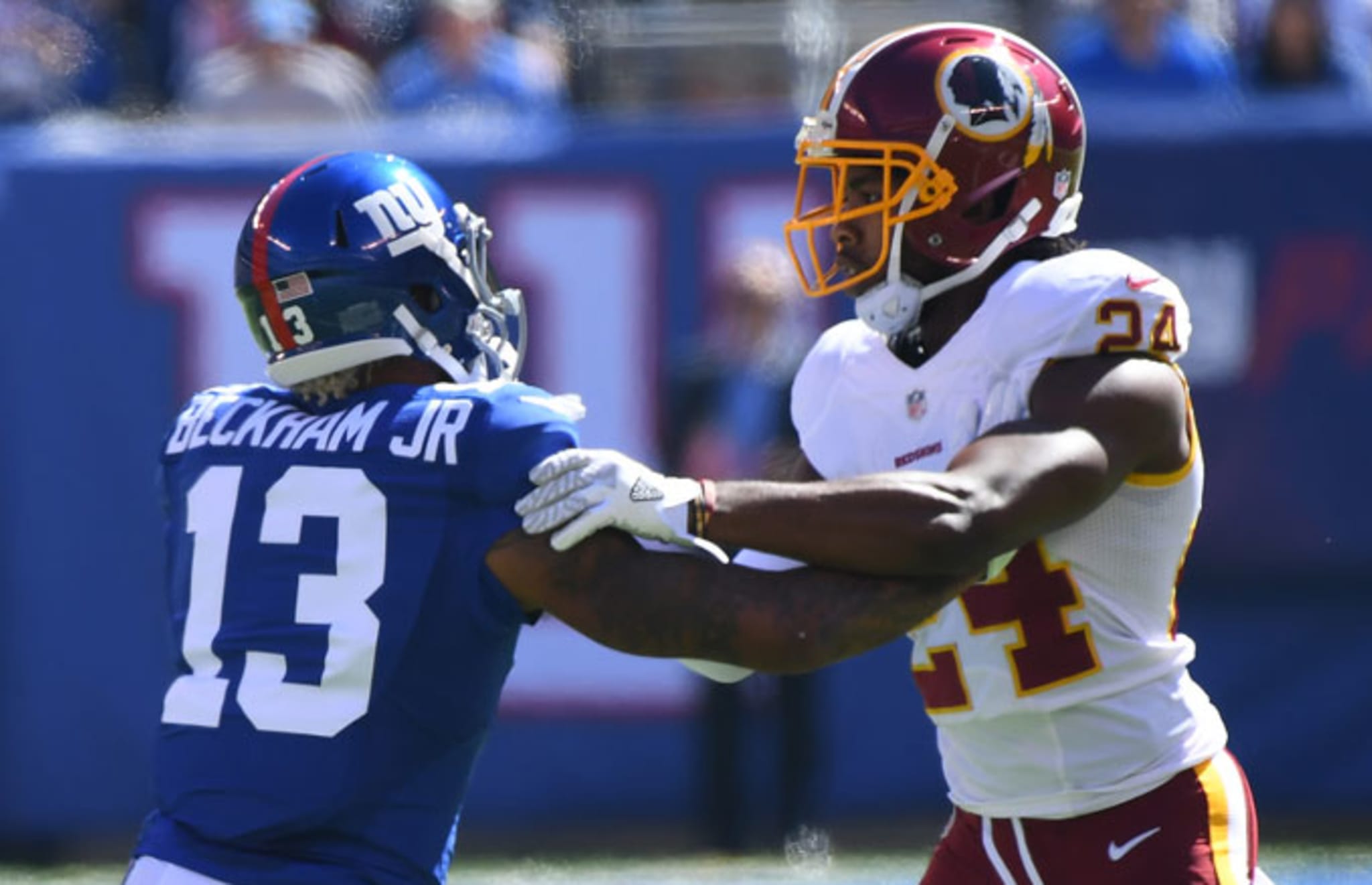 Odell Beckham Jr. and Josh Norman get tangled up.