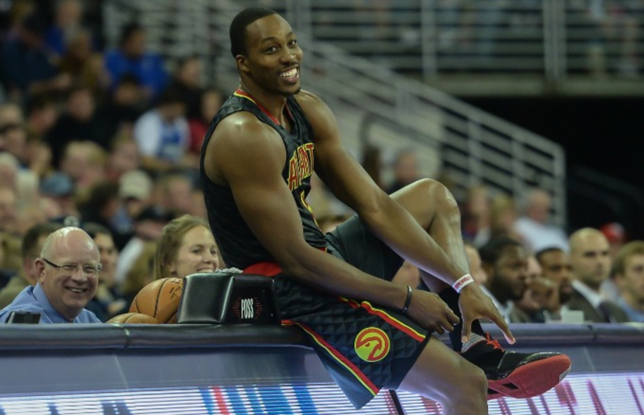 Dwight Howard prepares to check in to a game for the Hawks.