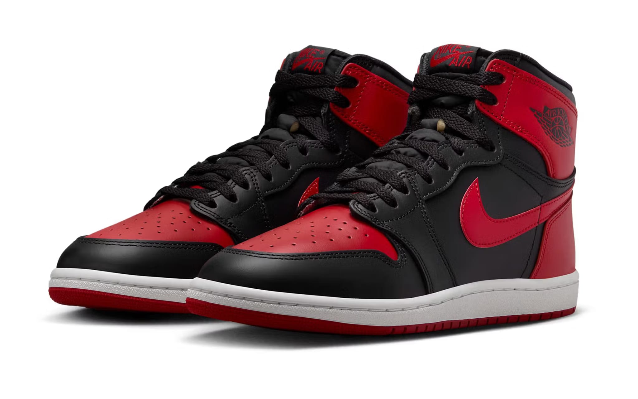 A pair of black and red Air Jordan 1 sneakers with the Nike swoosh and Jordan wings logo, on a white background.