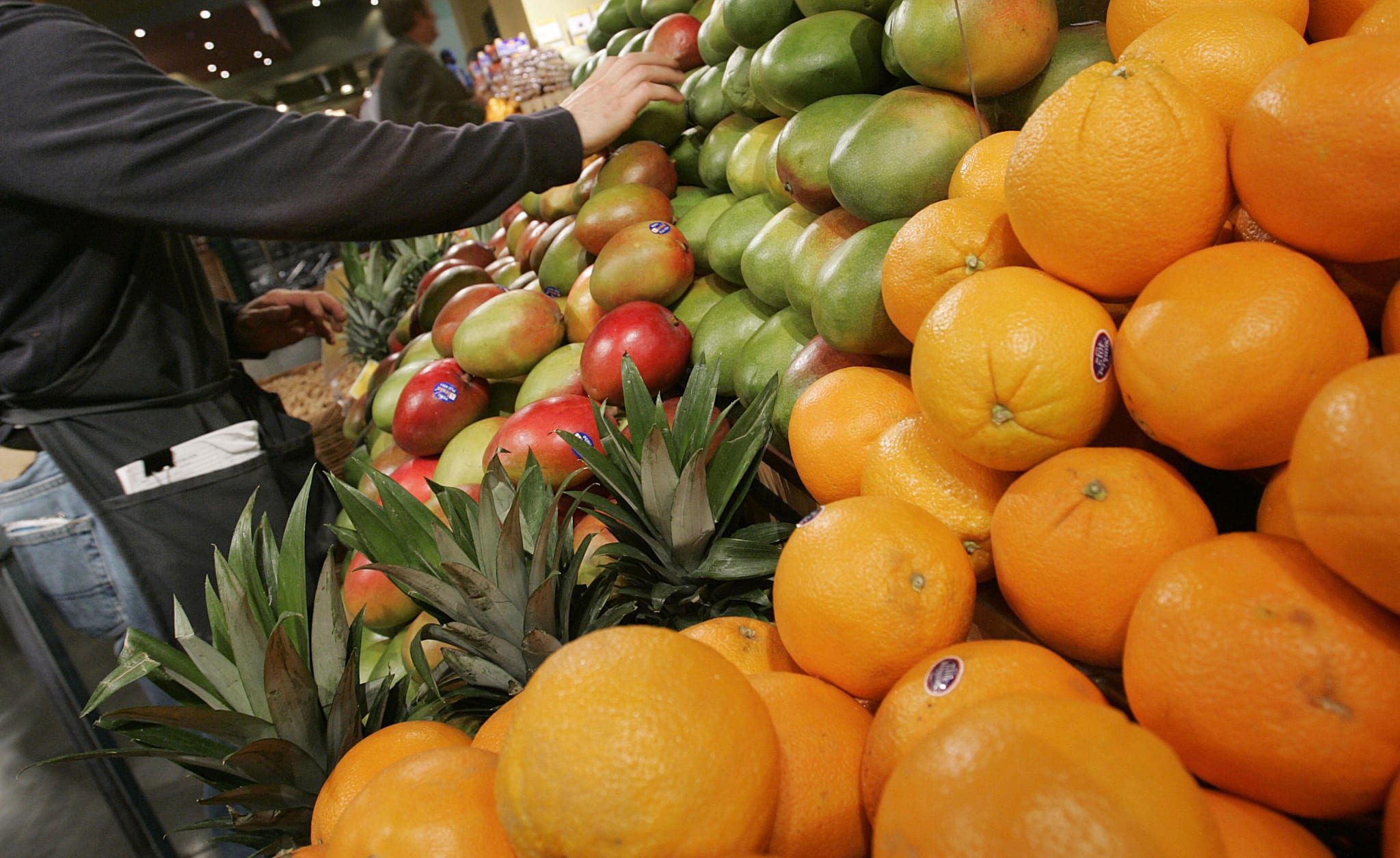 Person shopping the fruit aisle