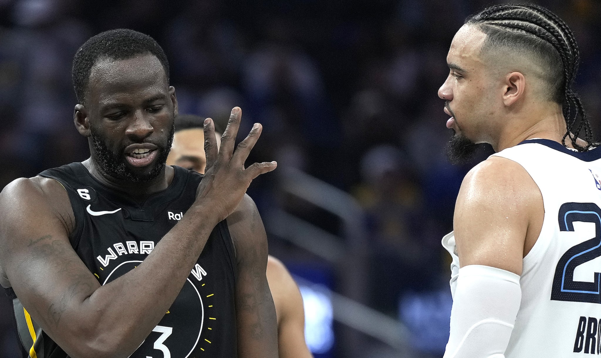 Golden State Warriors forward Draymond Green faces off against Memphis Grizzlies forward Dillon Brooks