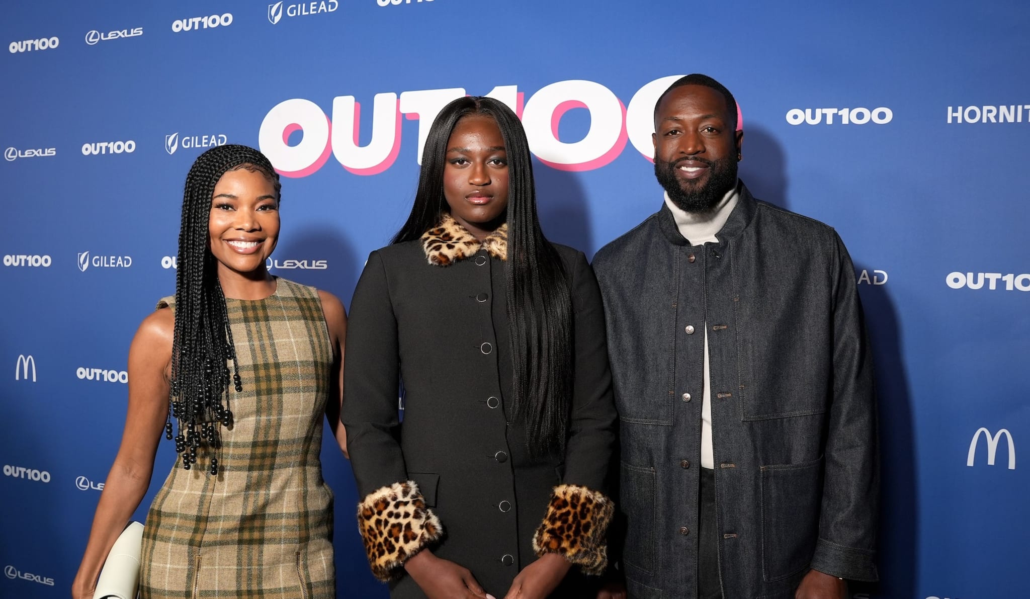 HOLLYWOOD, CALIFORNIA - DECEMBER 11: (L-R) Gabrielle Union, Zaya Wade and Dwyane Wade attend the Out100 Event 2024 at NeueHouse Hollywood on December 11, 2024 in Hollywood, California.