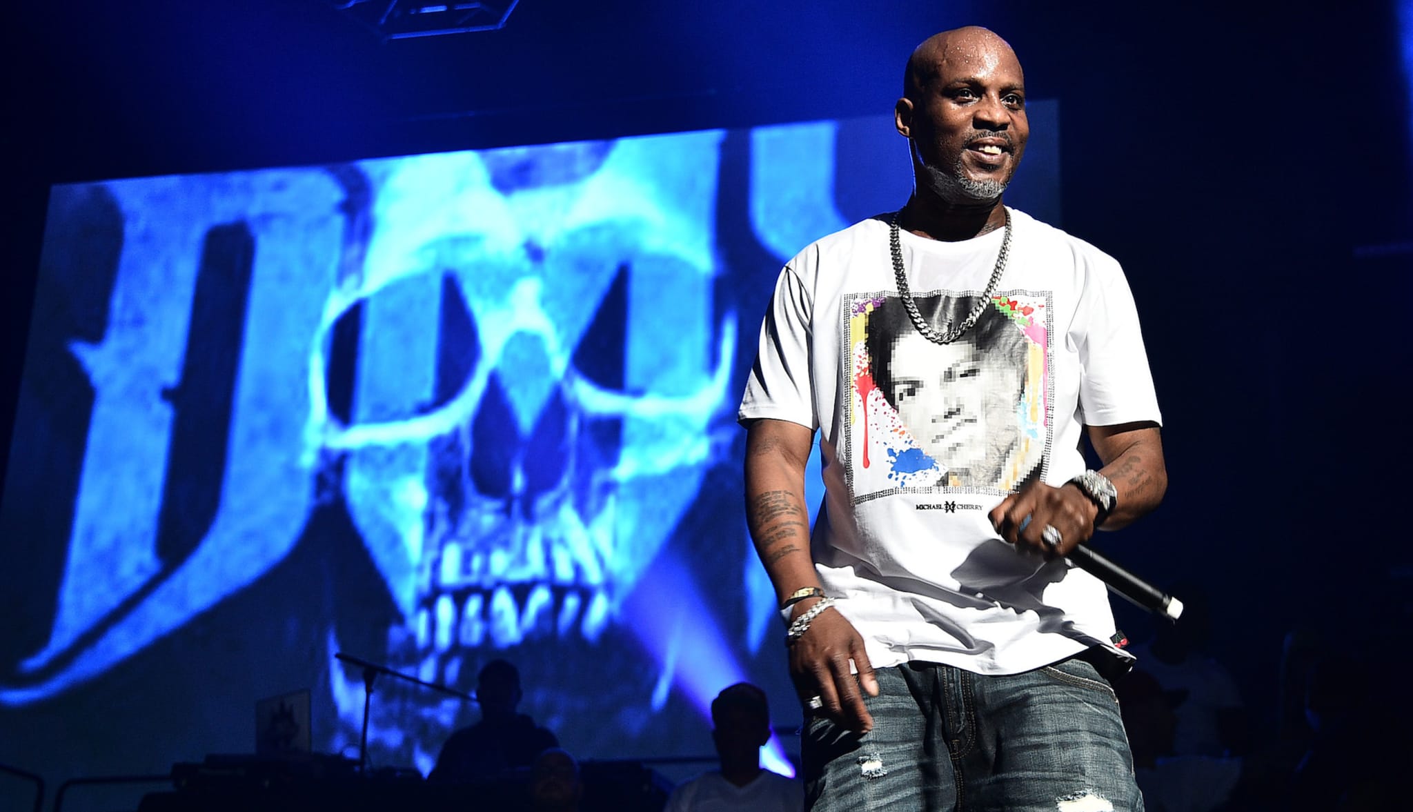 DMX pictured onstage with logo behind him