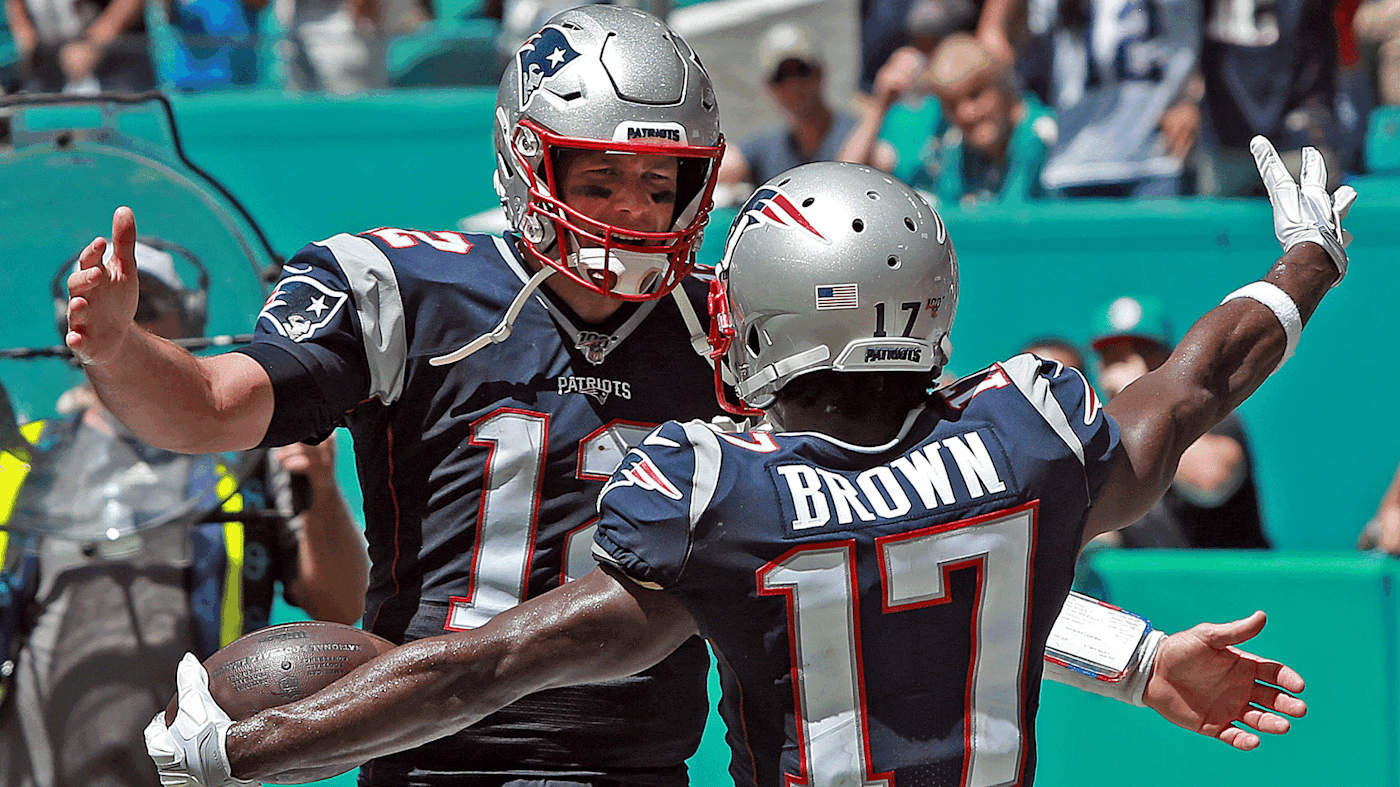 Tom Brady and Antonio Brown embrace after a touchdown.