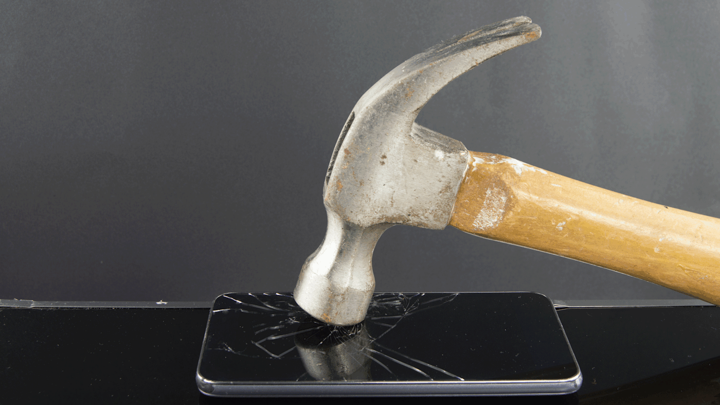 Hammer breaking cell phone.