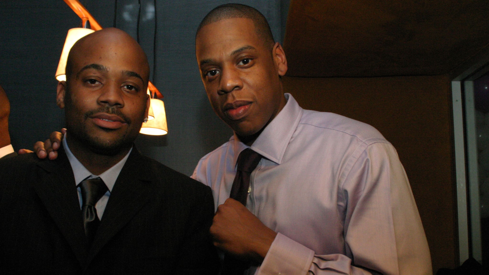 Damon Dash and Jay-Z in formal attire at an event