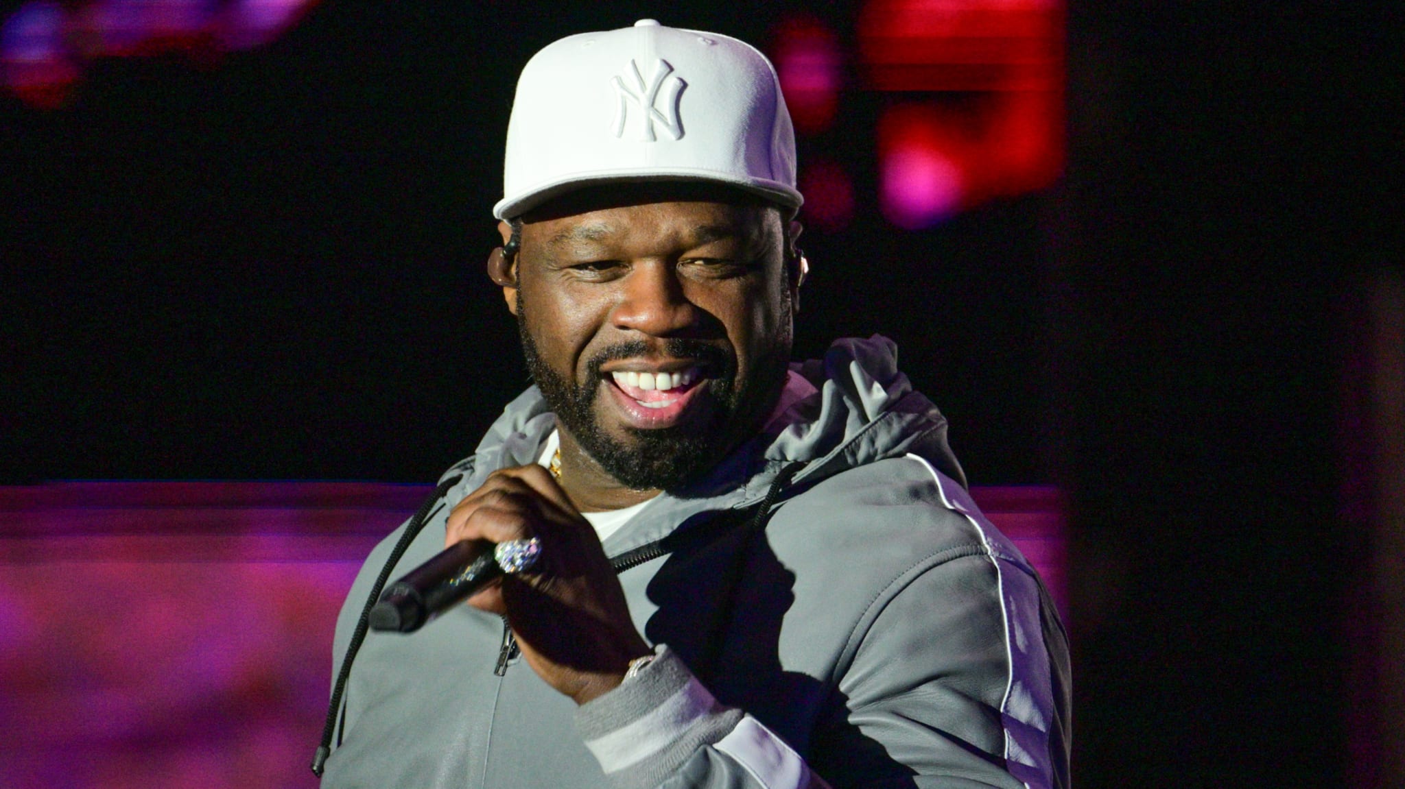 50 Cent on stage holding microphone