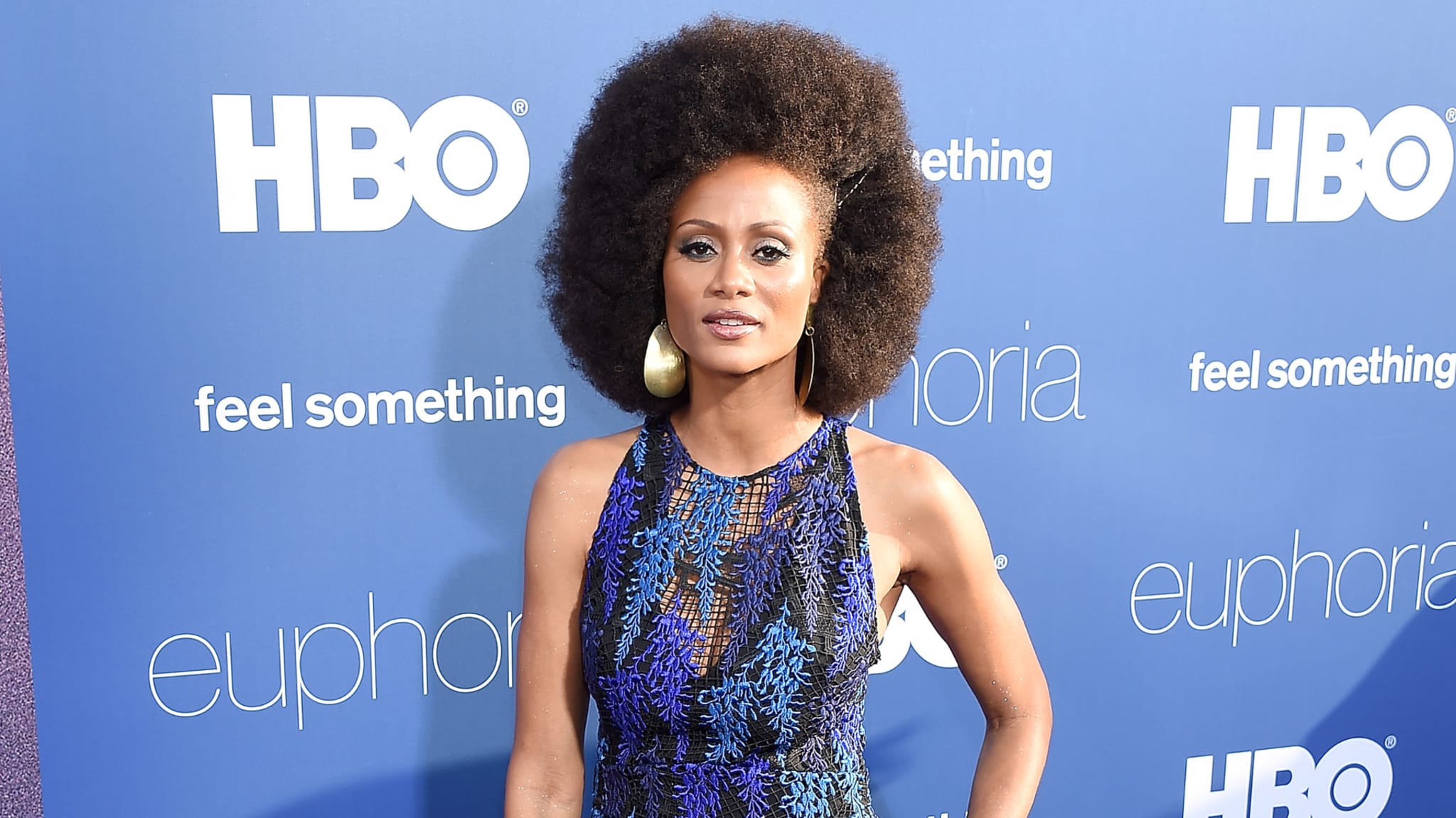 Actress in detailed sleeveless dress posing at HBO event