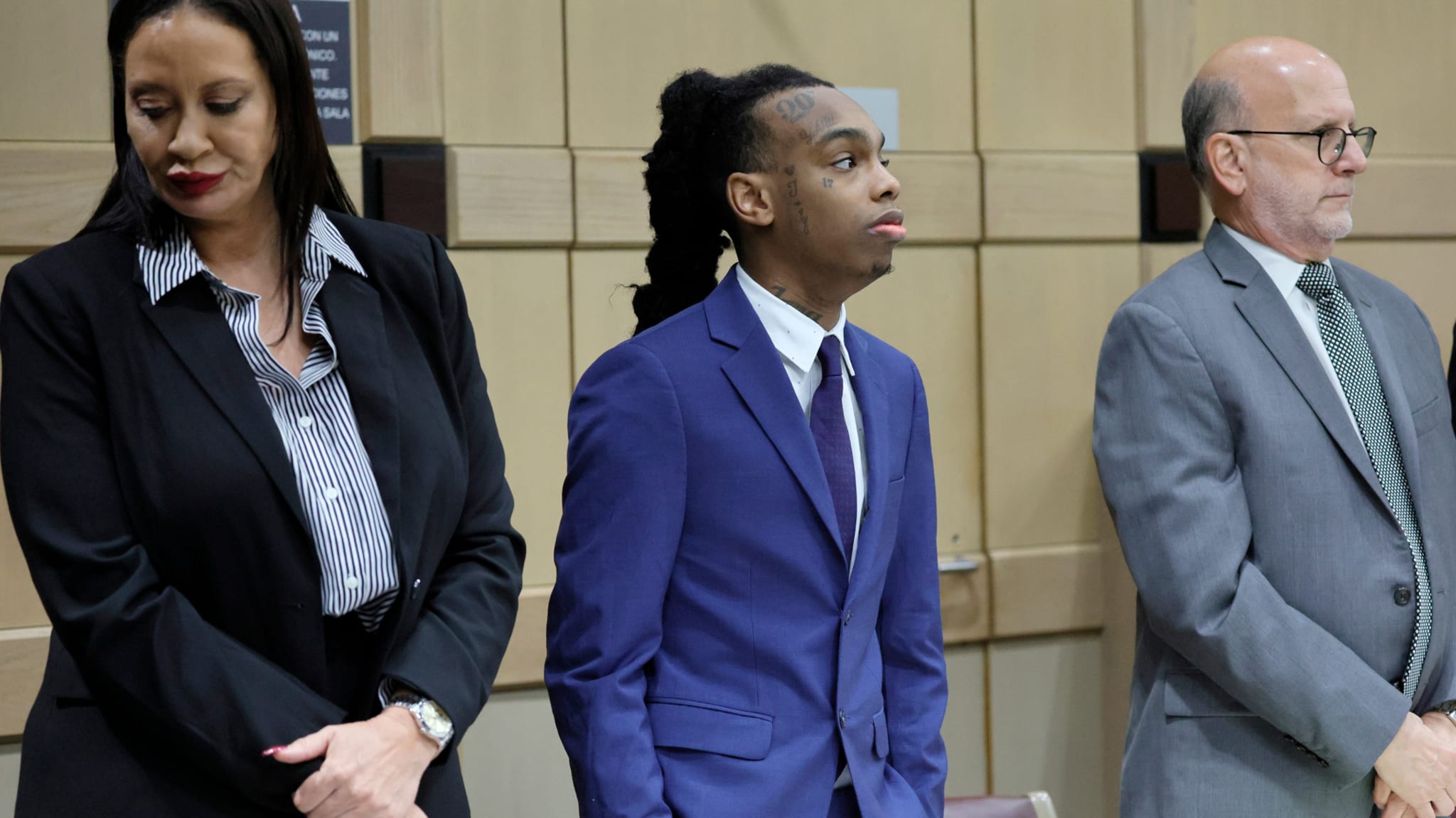 YNW Melly stands with his attorneys,Raven Ramona Liberty, left, and Stuart Adelstein, right, as jurors enter the courtroom for closing arguments in his trial