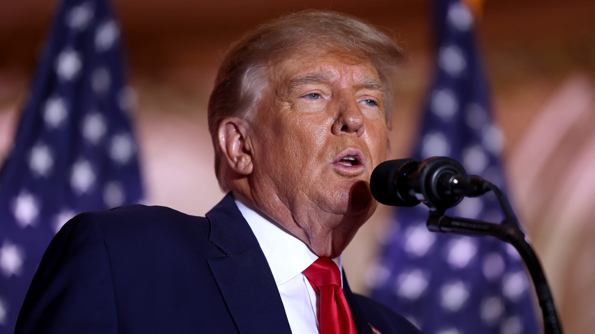 Trump is seen speaking into mic