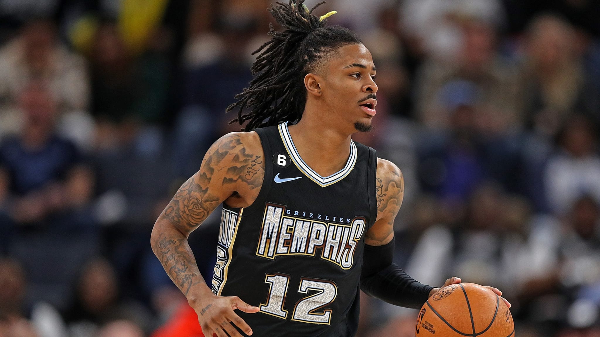 Ja Morant #12 of the Memphis Grizzlies brings the ball up court during the game against the Los Angeles Lakers at FedExForum