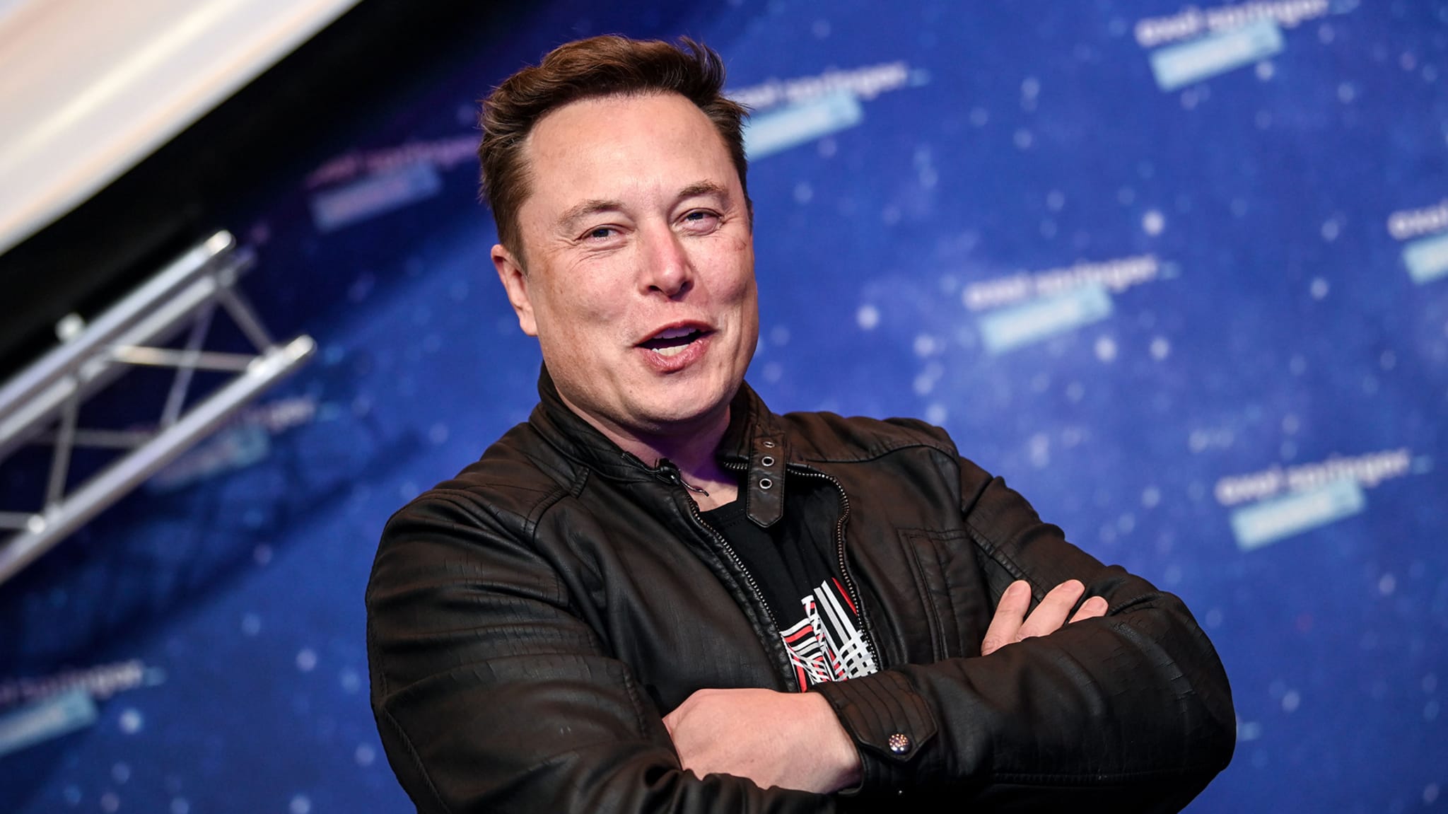 Elon Musk poses as he arrives on the red carpet for the Axel Springer Awards ceremony