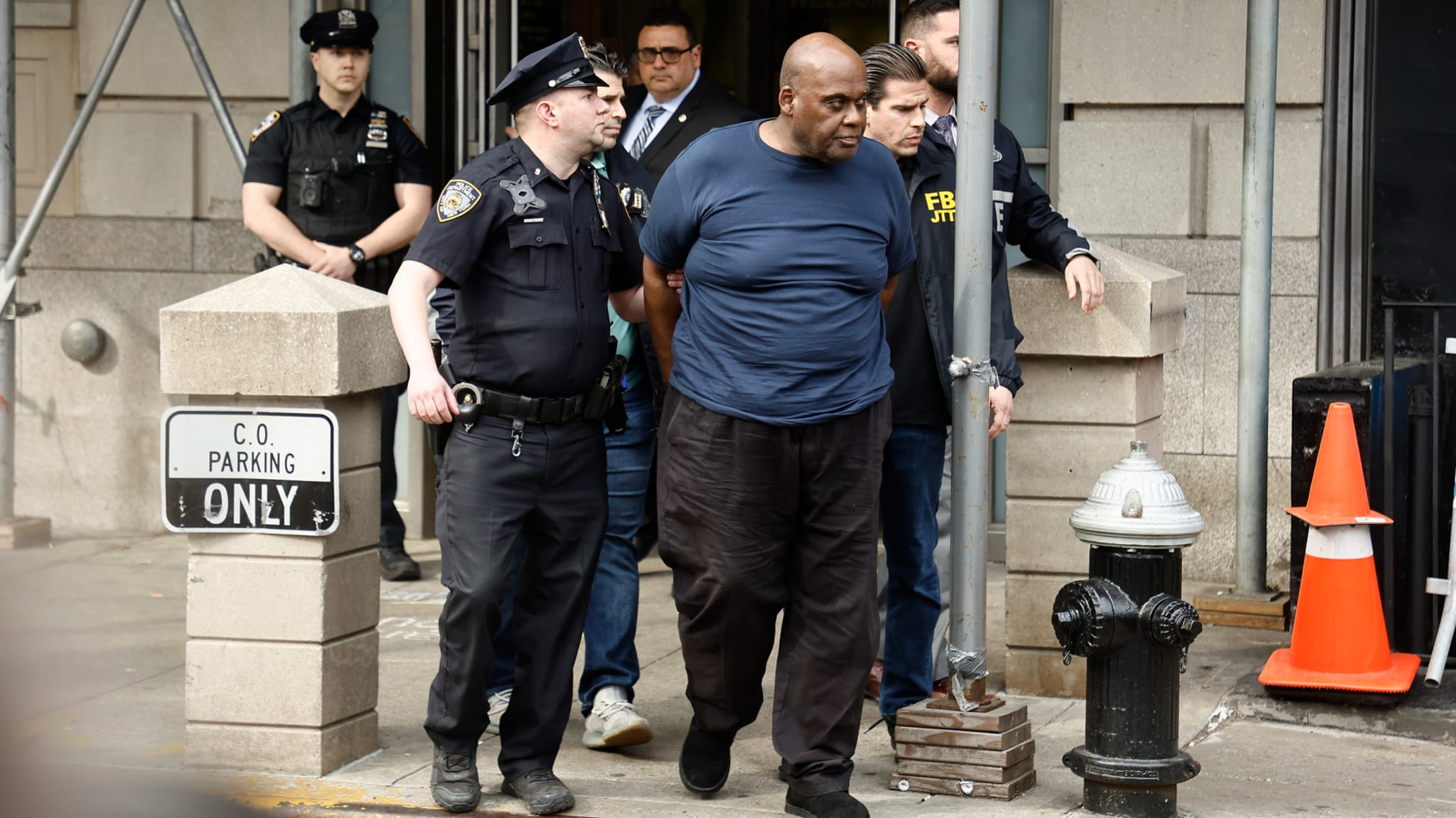 Suspected subway shooter is pictured in handcuffs