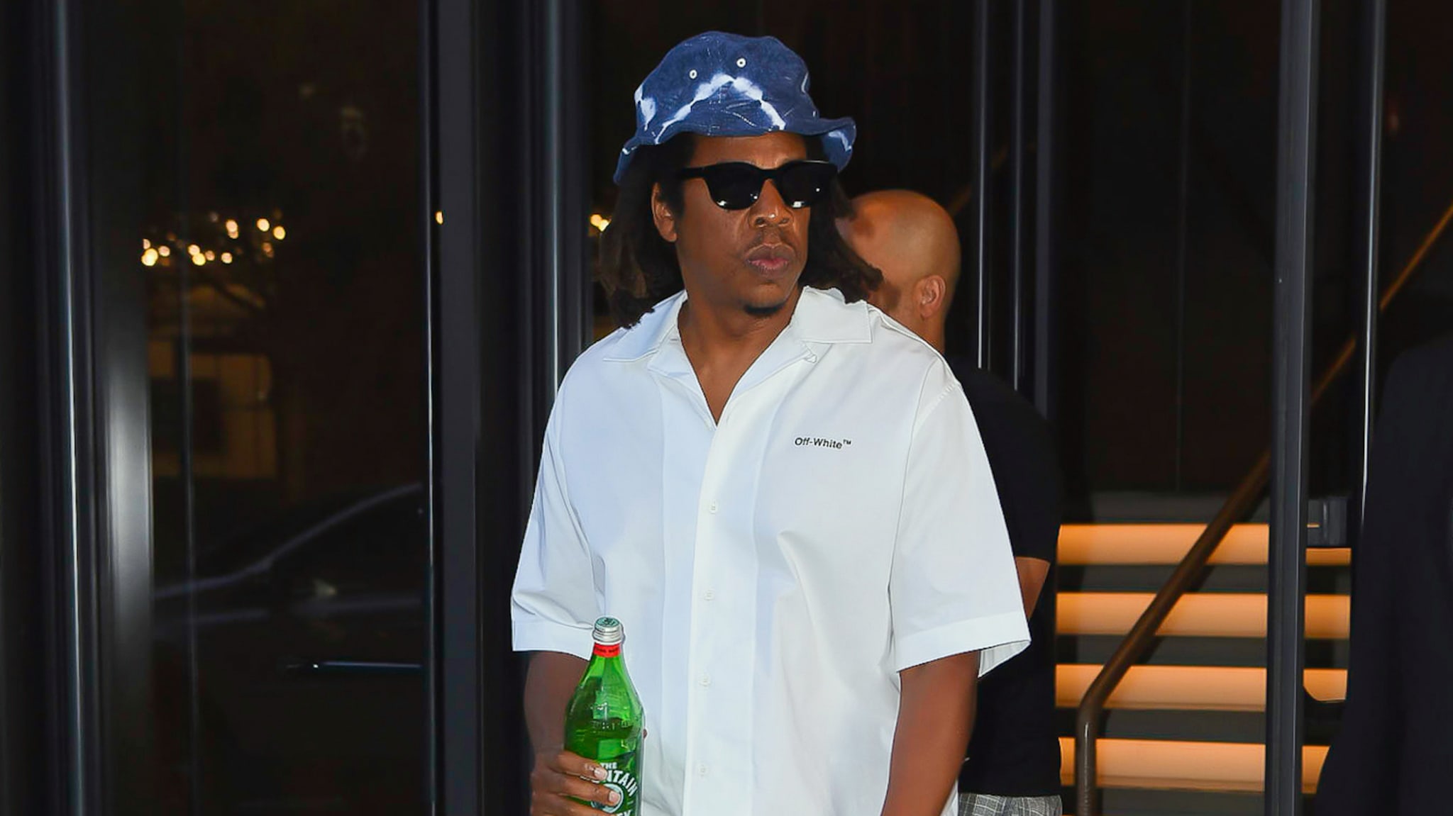 Jay Z is seen holding a bottle of water