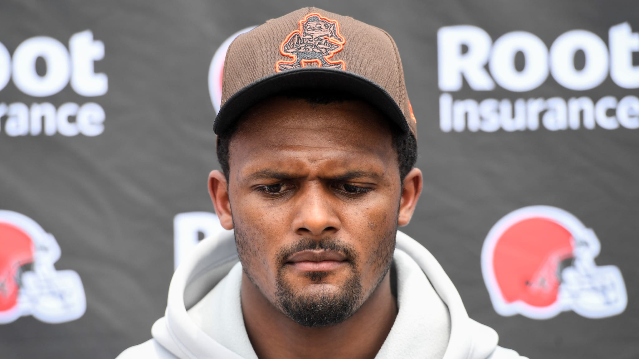 Deshaun Watson listens to questions during a press conference.
