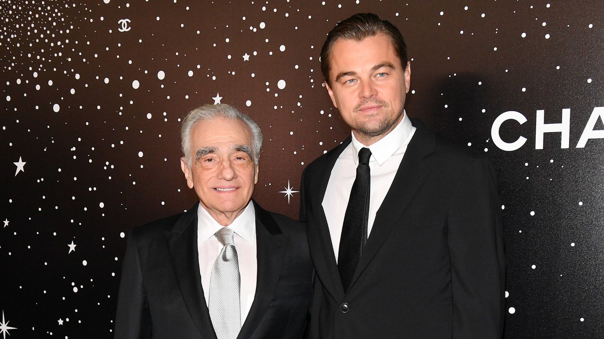 Two goats are pictured at a red carpet event