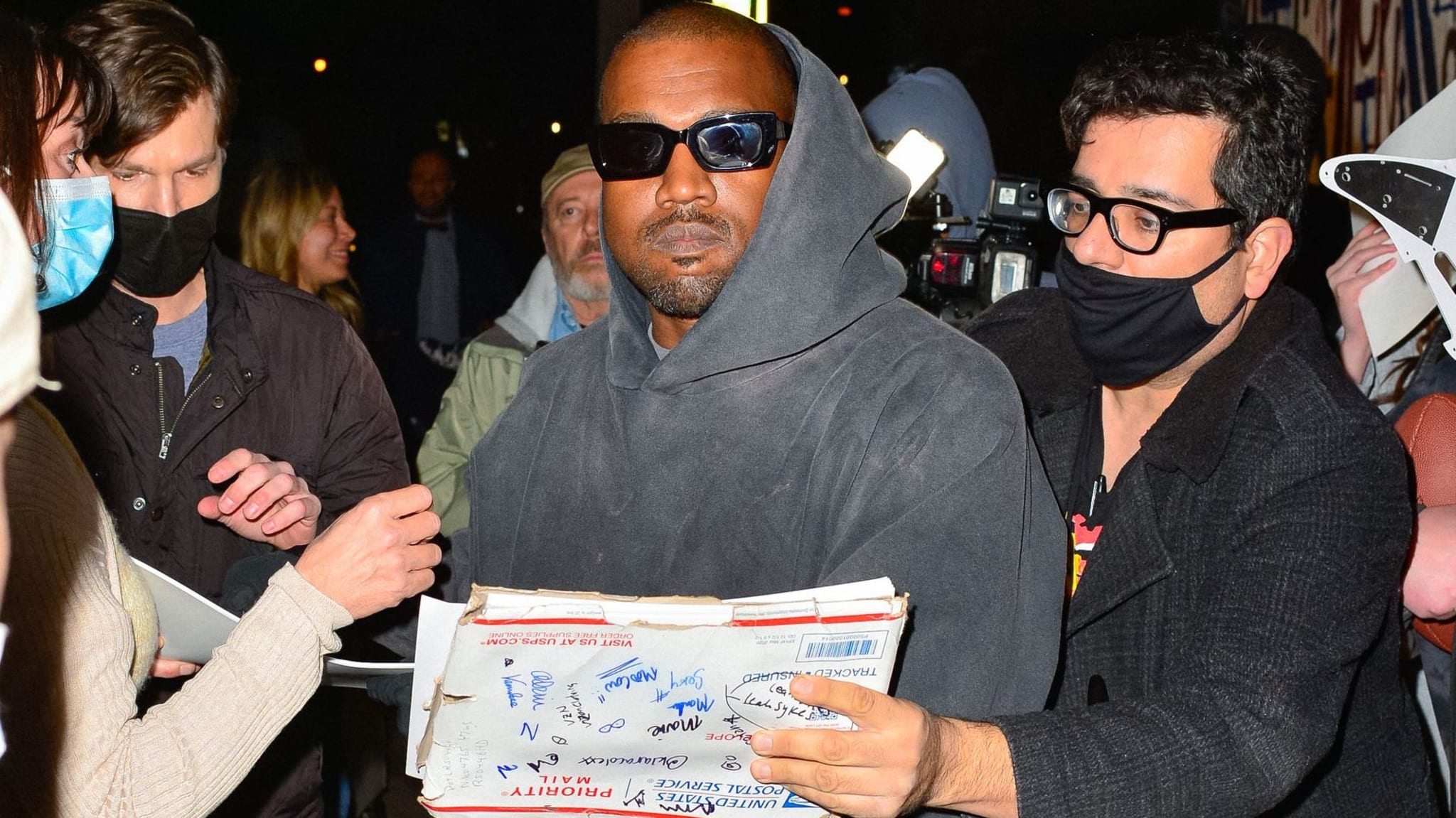 Ye is surrounded by paparazzi in Los Angeles