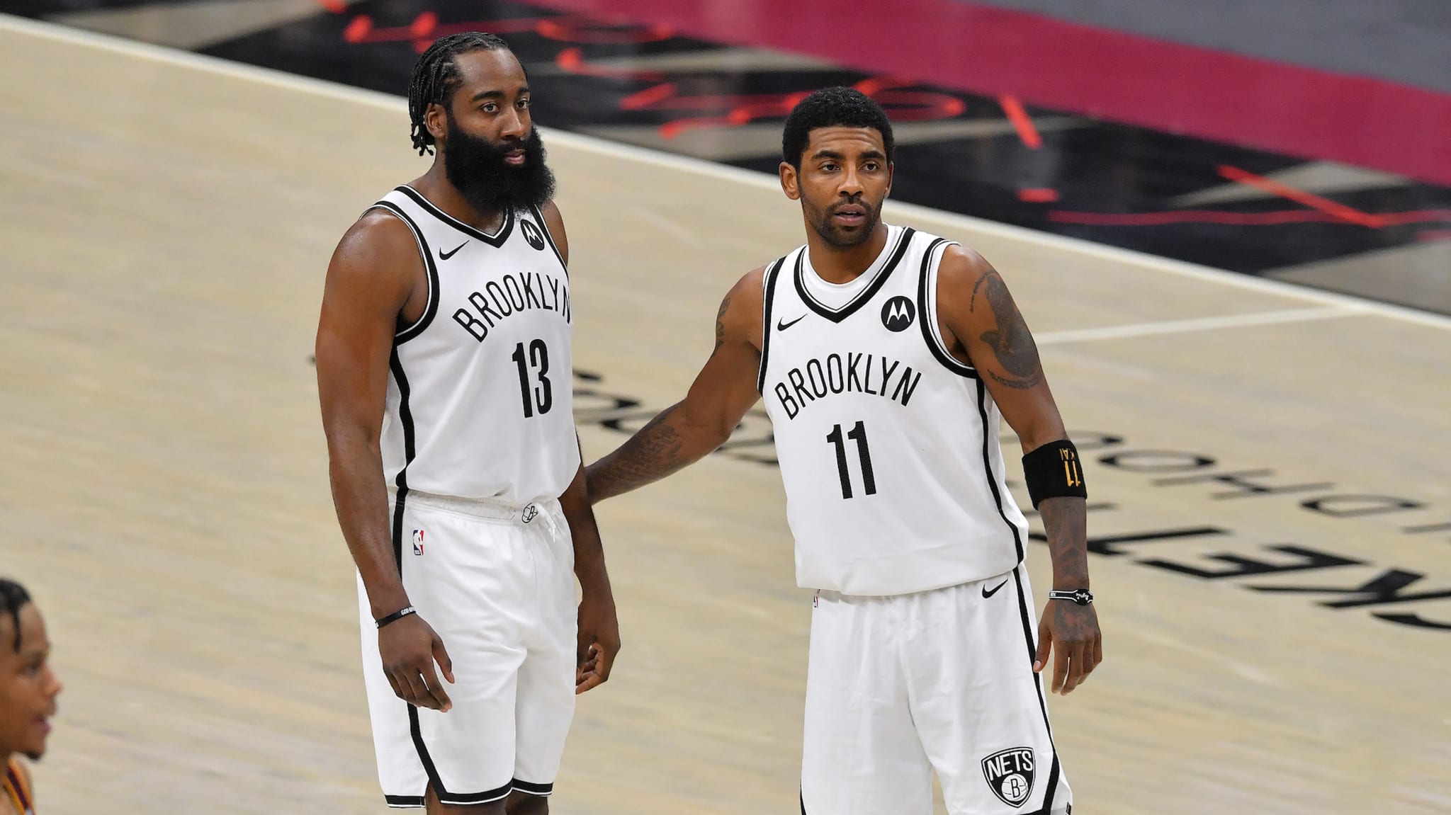 James Harden #13 talks with Kyrie Irving #11 of the Brooklyn Nets