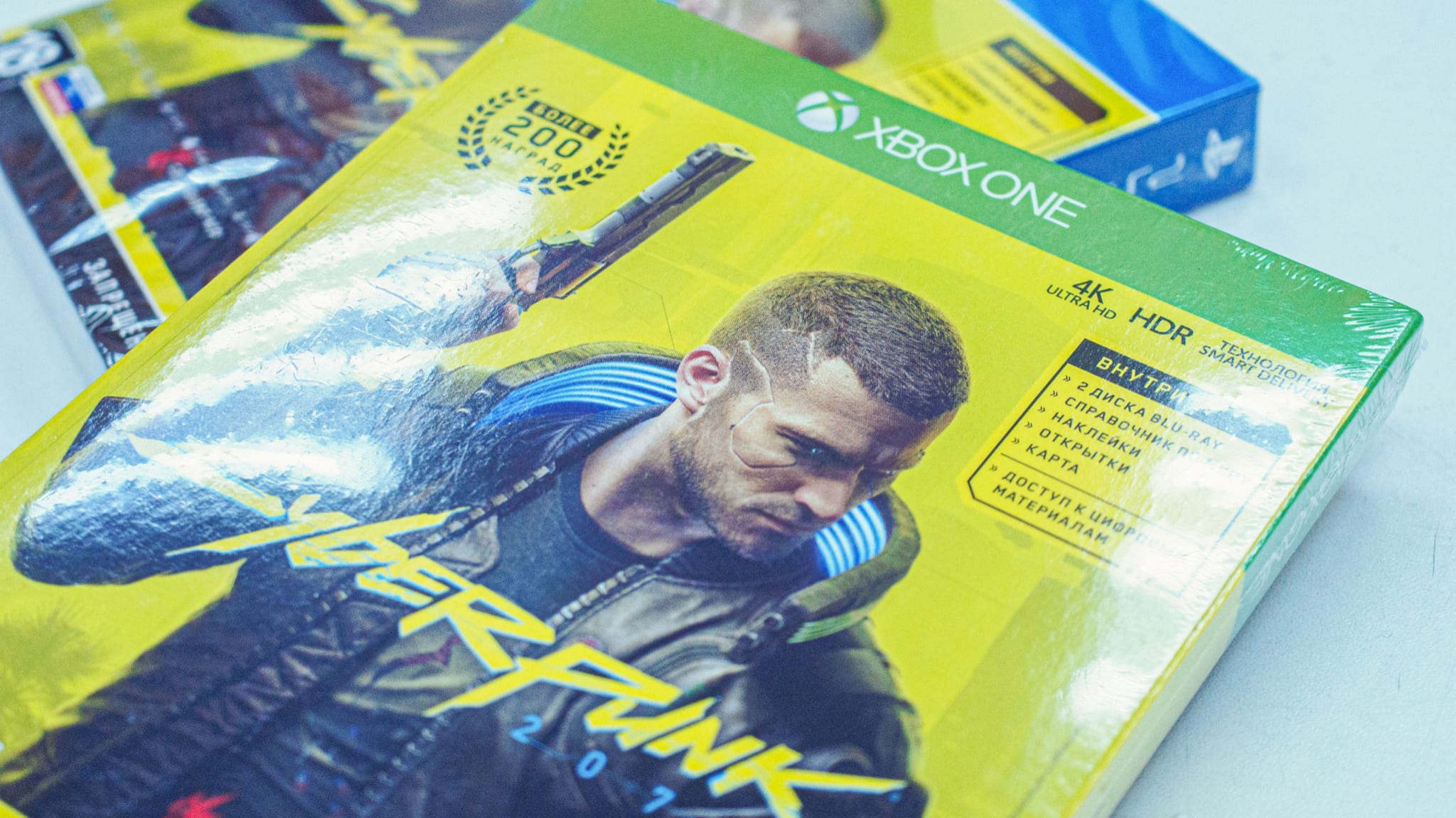 Cyberpunk game discs for PlayStation and XBox consoles.