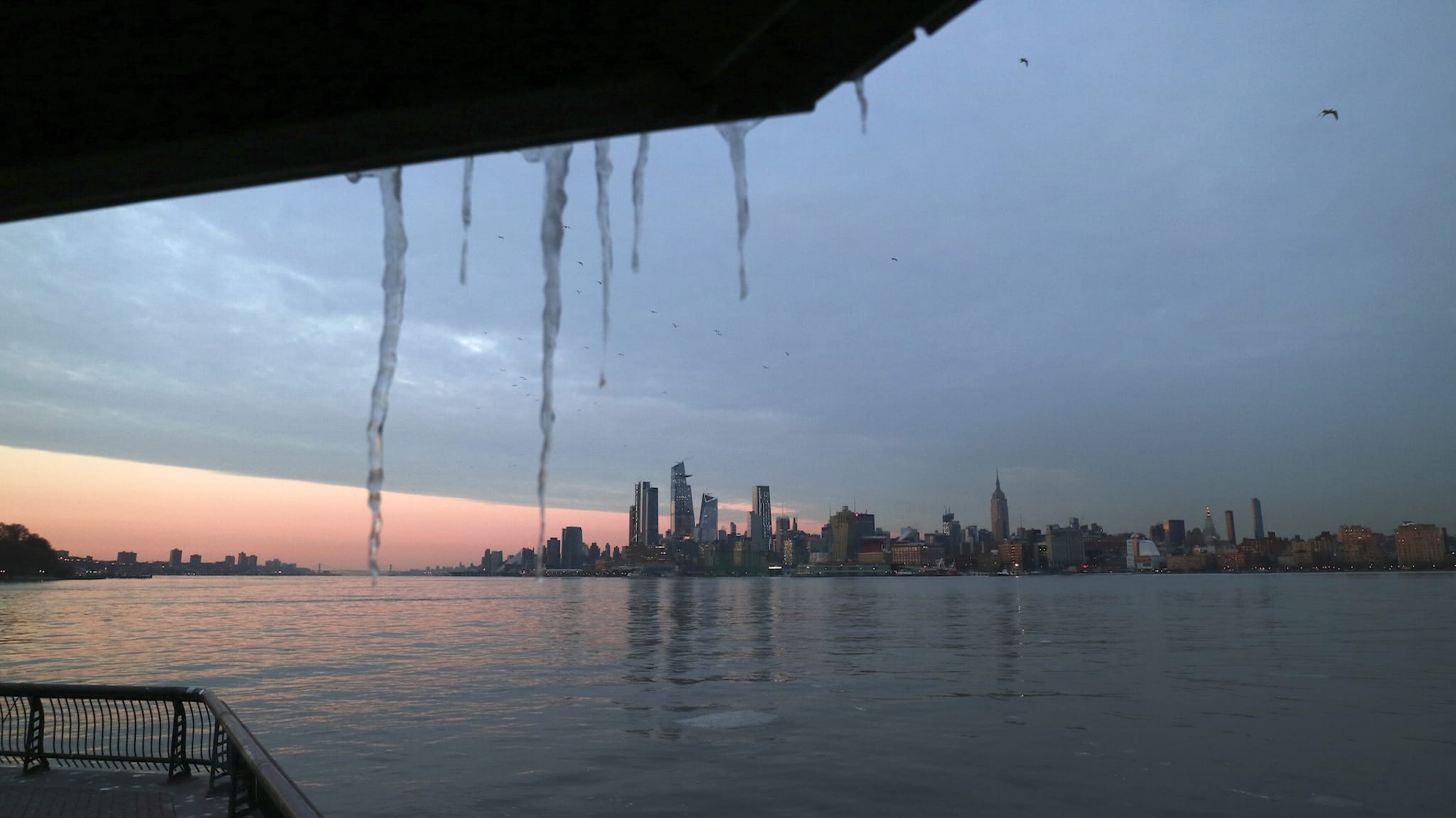Icicles hang in front of Hudson Yards and the Empire State Building