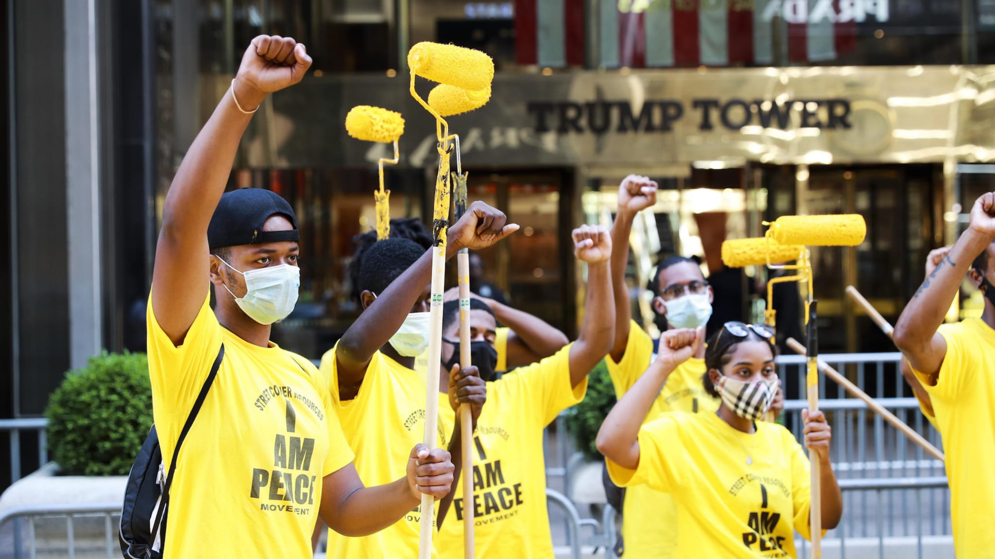 People who paint "Black Lives Matter" mural pose for a photo