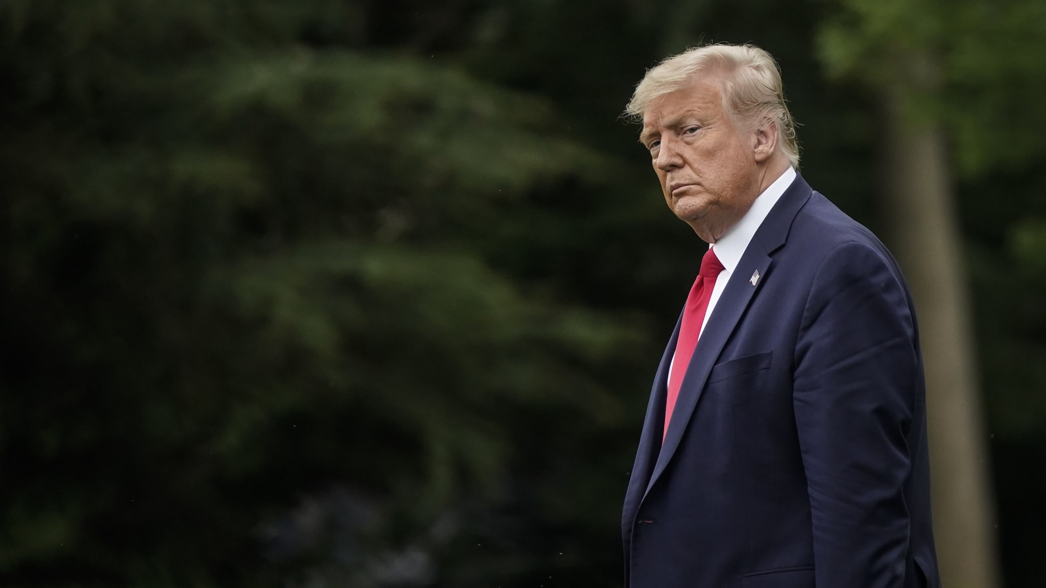 U.S. President Donald Trump walks toward Marine One