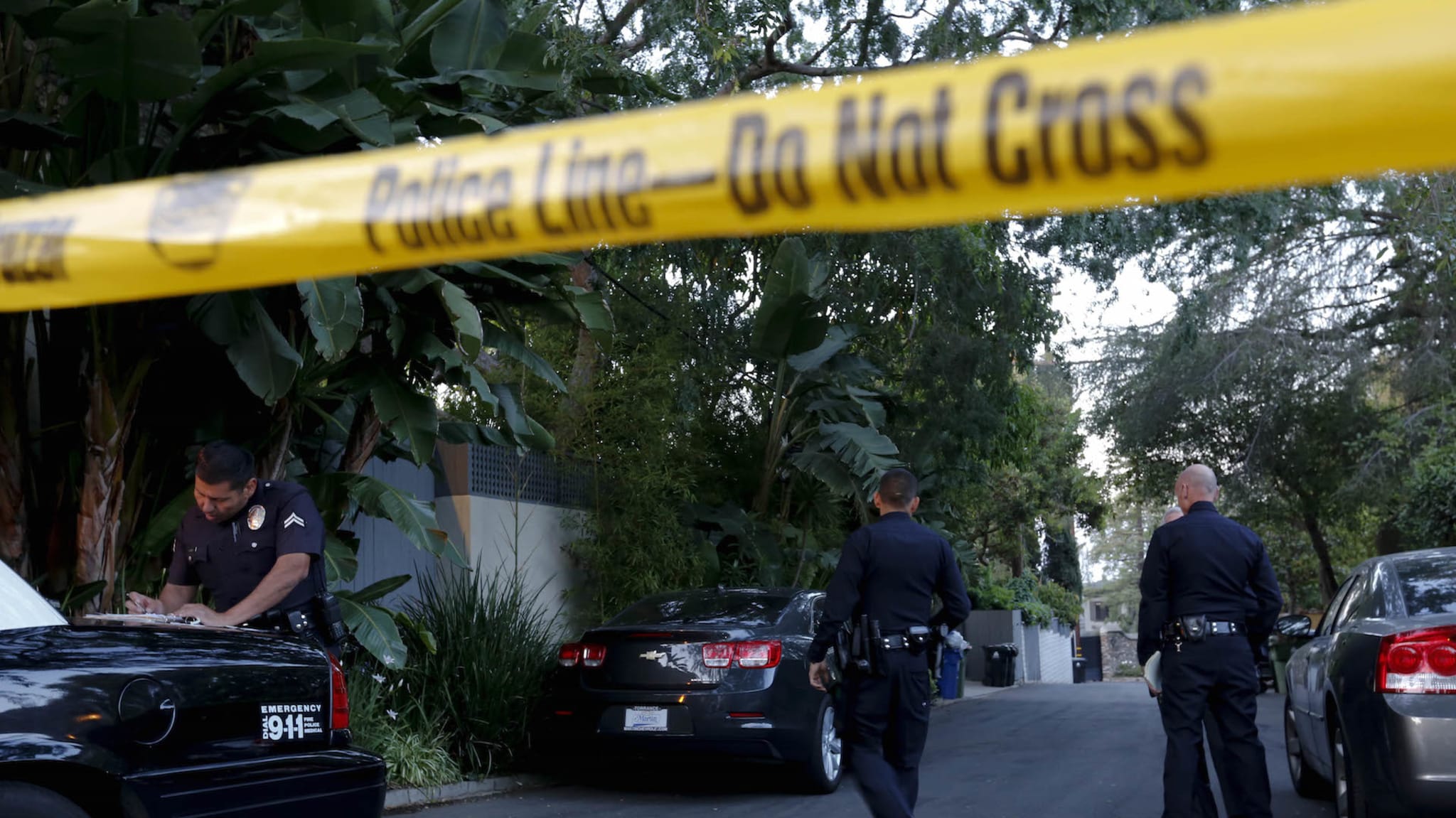 Police and media lined the entrance