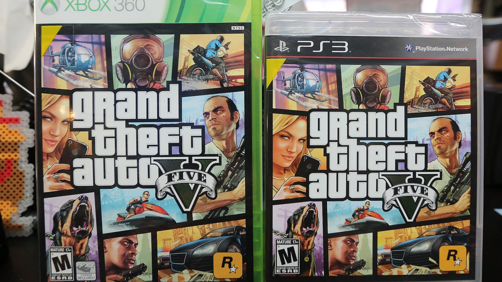 Copies of Grand Theft Auto V are displayed at the 8 Bit & Up video games shop.