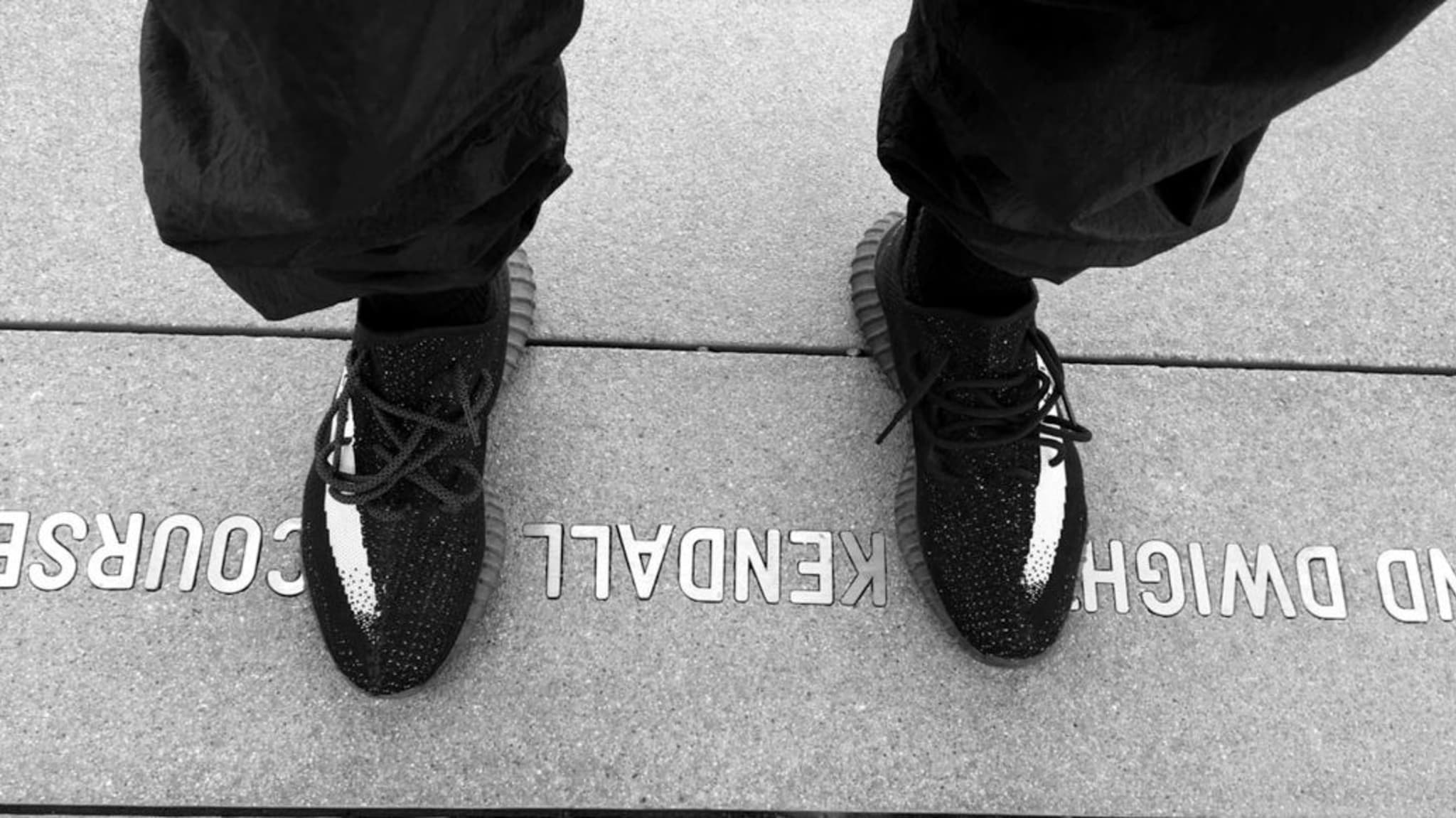 Kanye West Wears Black/White Stripe Yeezys (1)