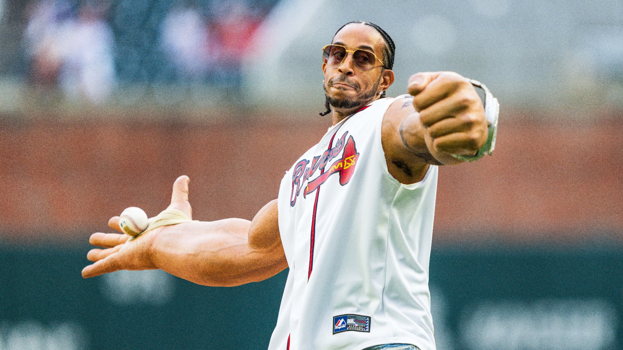 Ludacris throws out the ceremonial first pitch before the game between the Atlanta Braves and the Colorado Rockies.
