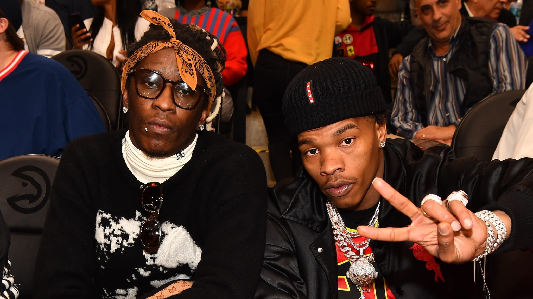 Rappers Young Thug and Lil Baby attend The Golden State Warriors vs Atlanta Hawks Game at State Farm Arena on December 3, 2018 in Atlanta, Georgia.