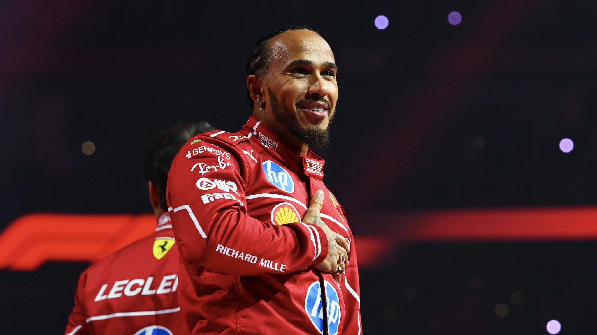 Lewis Hamilton of Great Britain and Scuderia Ferrari waves to the crowd from the stage during F1 75 Live at The O2 Arena