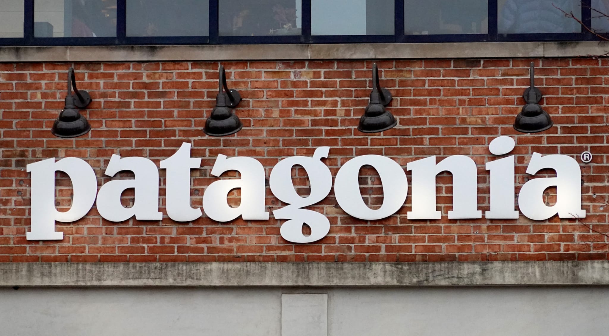 A sign hangs in front of a Patagonia store on October 29, 2021 in Chicago, Illinois