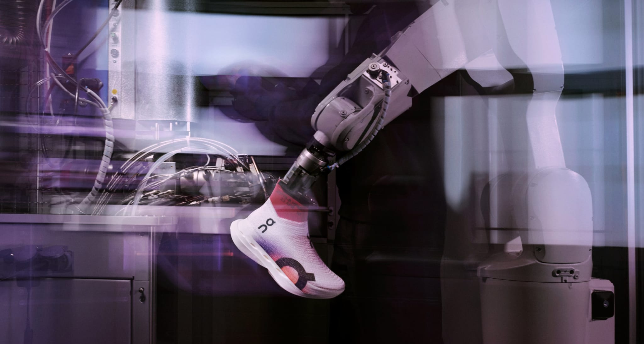 A person with a prosthetic arm works with machines in a high-tech laboratory setting. The image is dynamic, showing motion blur and a focus on technology