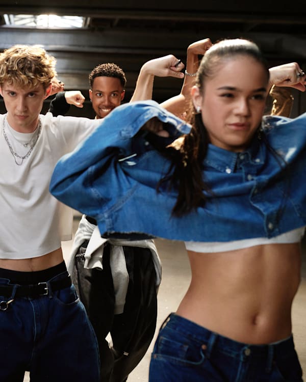 Troye Sivan dancing alongside a group of dancers in the Gap fall campaign 'Get Loose.'
