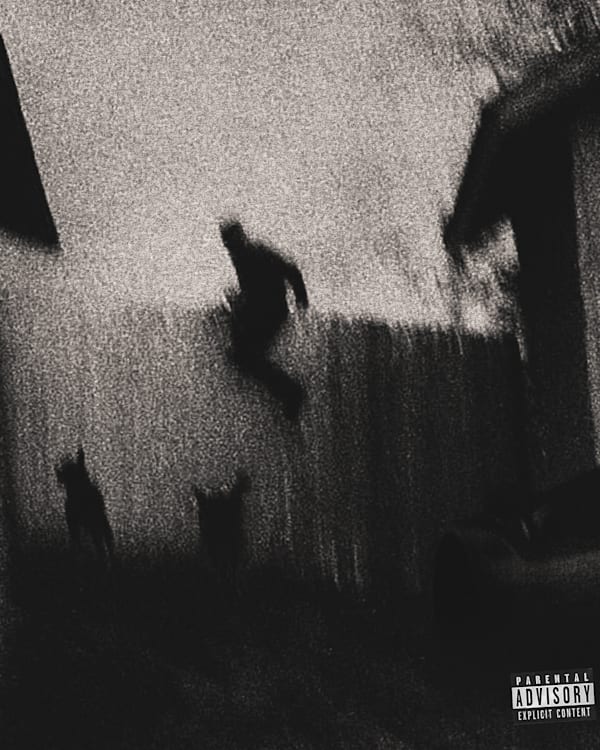 A grainy, black and white image of a person jumping over a fence with two dogs nearby. Parental advisory label in the corner.