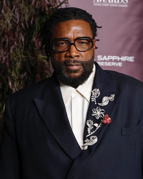 (L) Questlove attends the WSJ. Magazine 2025 Innovator Awards at MoMA on October 29, 2025 in New York City. (R) D'Angelo performs onstage at The Tabernacle on June 14, 2015 in Atlanta, Georgia.