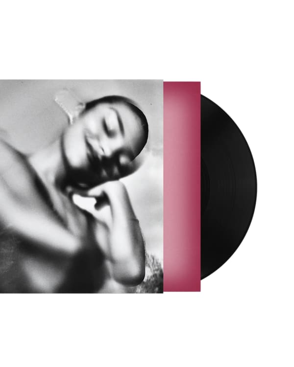 A blurred black and white image of a person on a vinyl record cover with a pink border.
