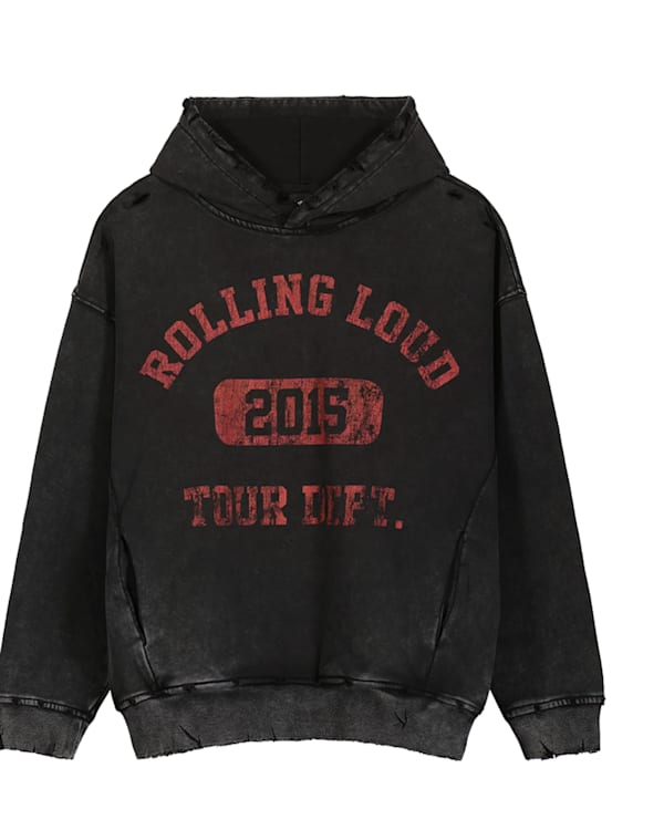 A black hoodie with "Rolling Loud 2015 Tour Life" text and red pants with star patterns and studs.
