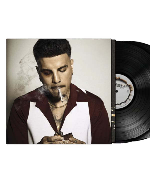 A man on an album cover smoking, with a vinyl record partially visible. The background is plain.