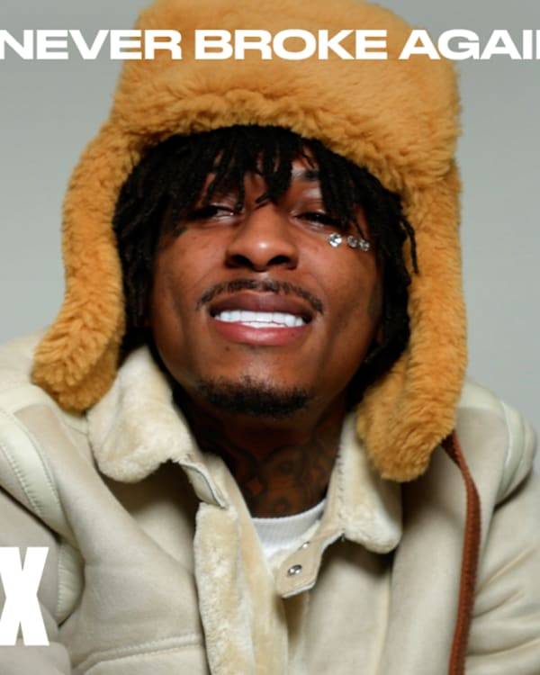 NBA YoungBoy wearing a fuzzy hat and coat smiles, with "YOUNGBOY NEVER BROKE AGAIN" and "COMPLEX" text on the image.