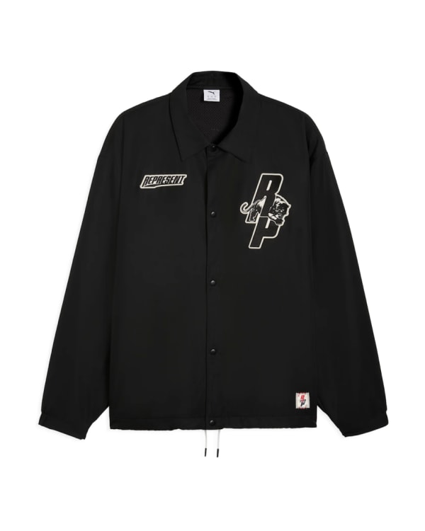 A pair of white and black sneakers with a beige sole, and a black jacket featuring a logo and patch.
