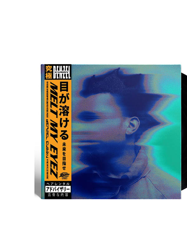 Vinyl record with a blurred, abstract face on the cover and Japanese text on the left.