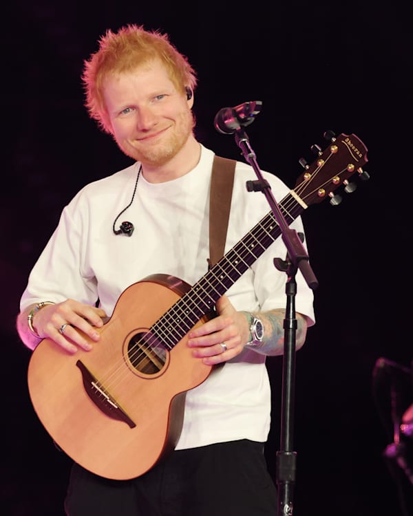 Left: Ed Sheeran holding a guitar on stage. Right: Five members of KATSEYE posing at an event.