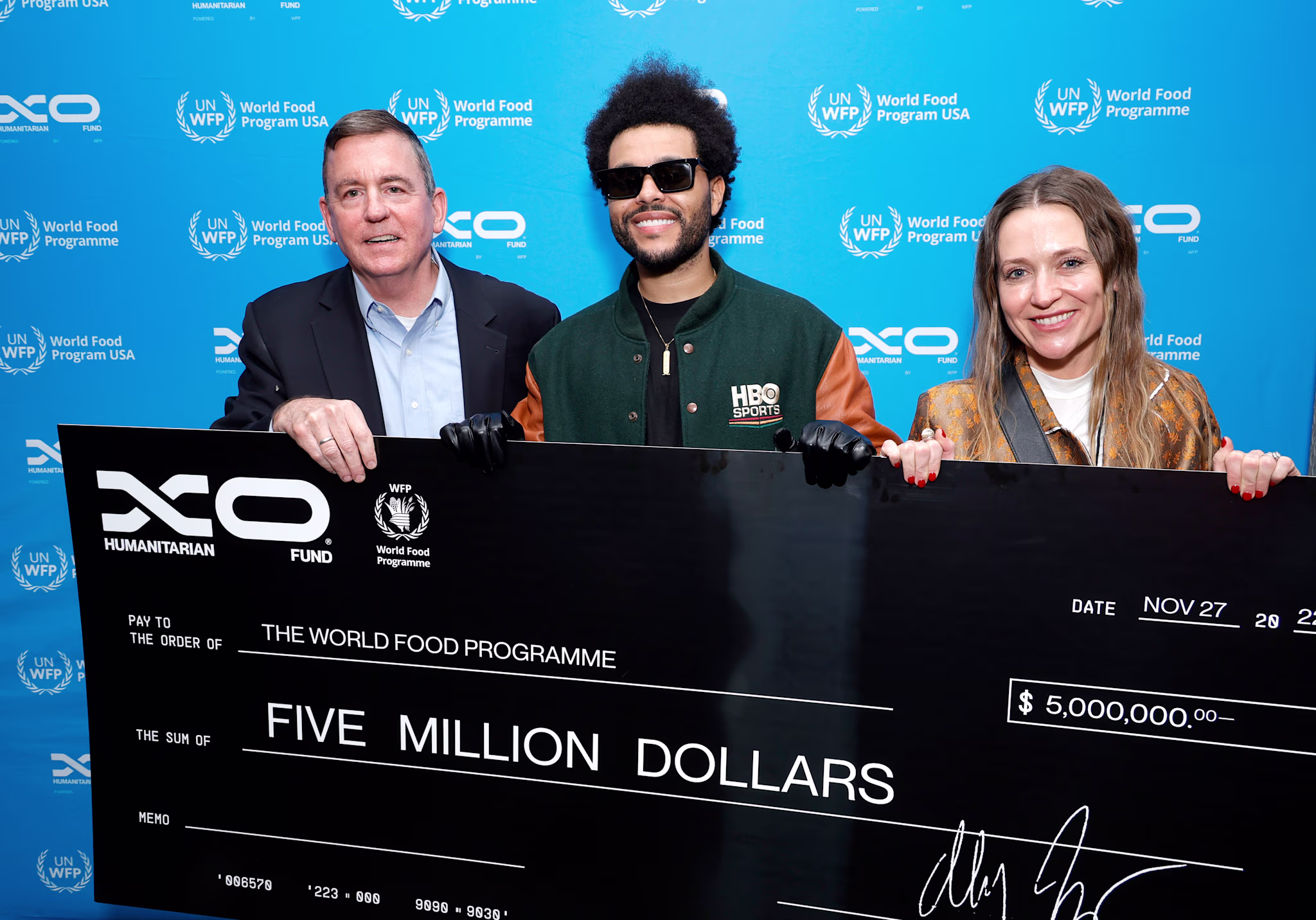 The Weeknd presents 5 million cheque