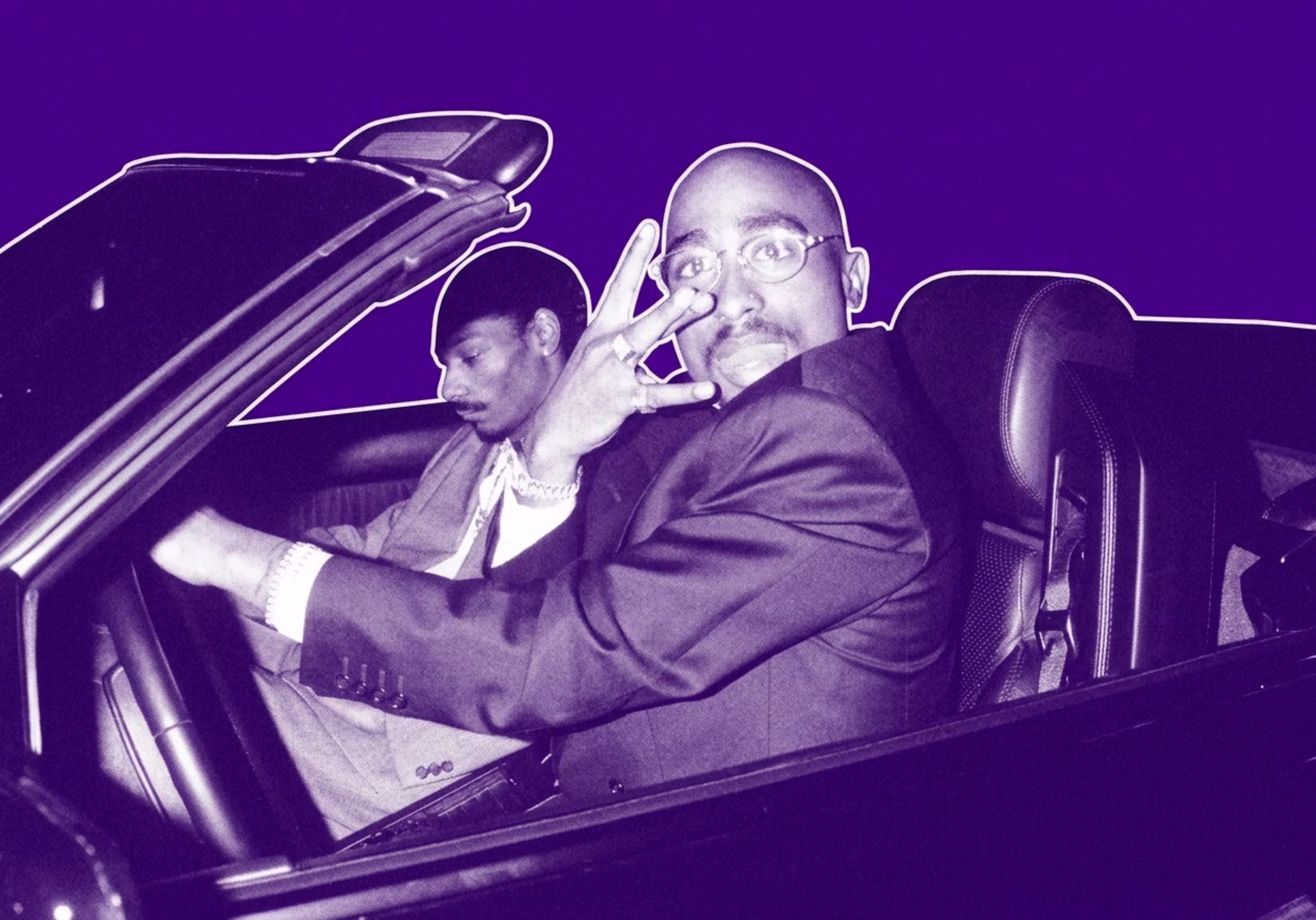 Tupac Shakur and Snoop Dogg in a convertible car, Tupac making a hand gesture, both dressed in suits.