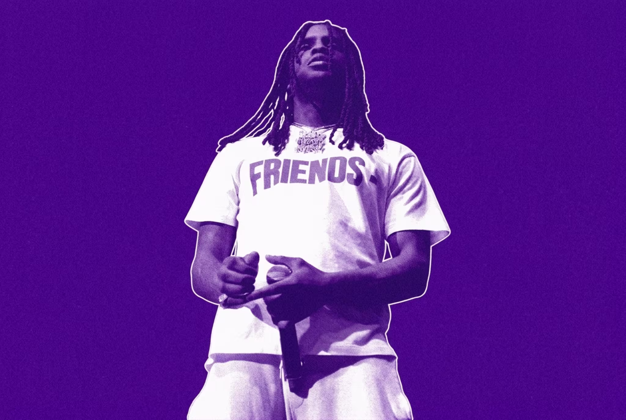Chief Keef wearing a "FRIENDS" shirt, holding a microphone, with dramatic blue and white stage lighting.
