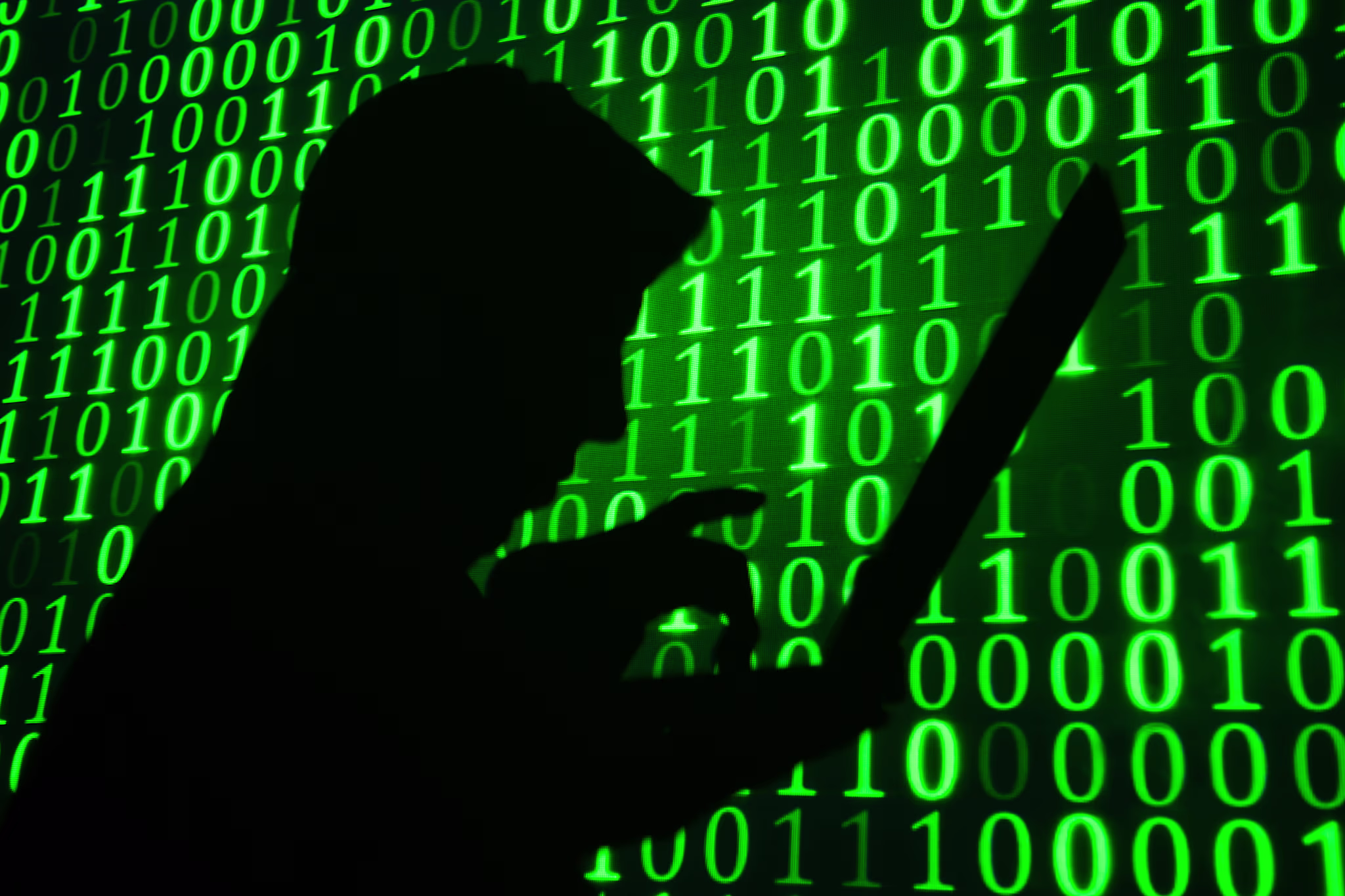 Computer hacker in front of screen