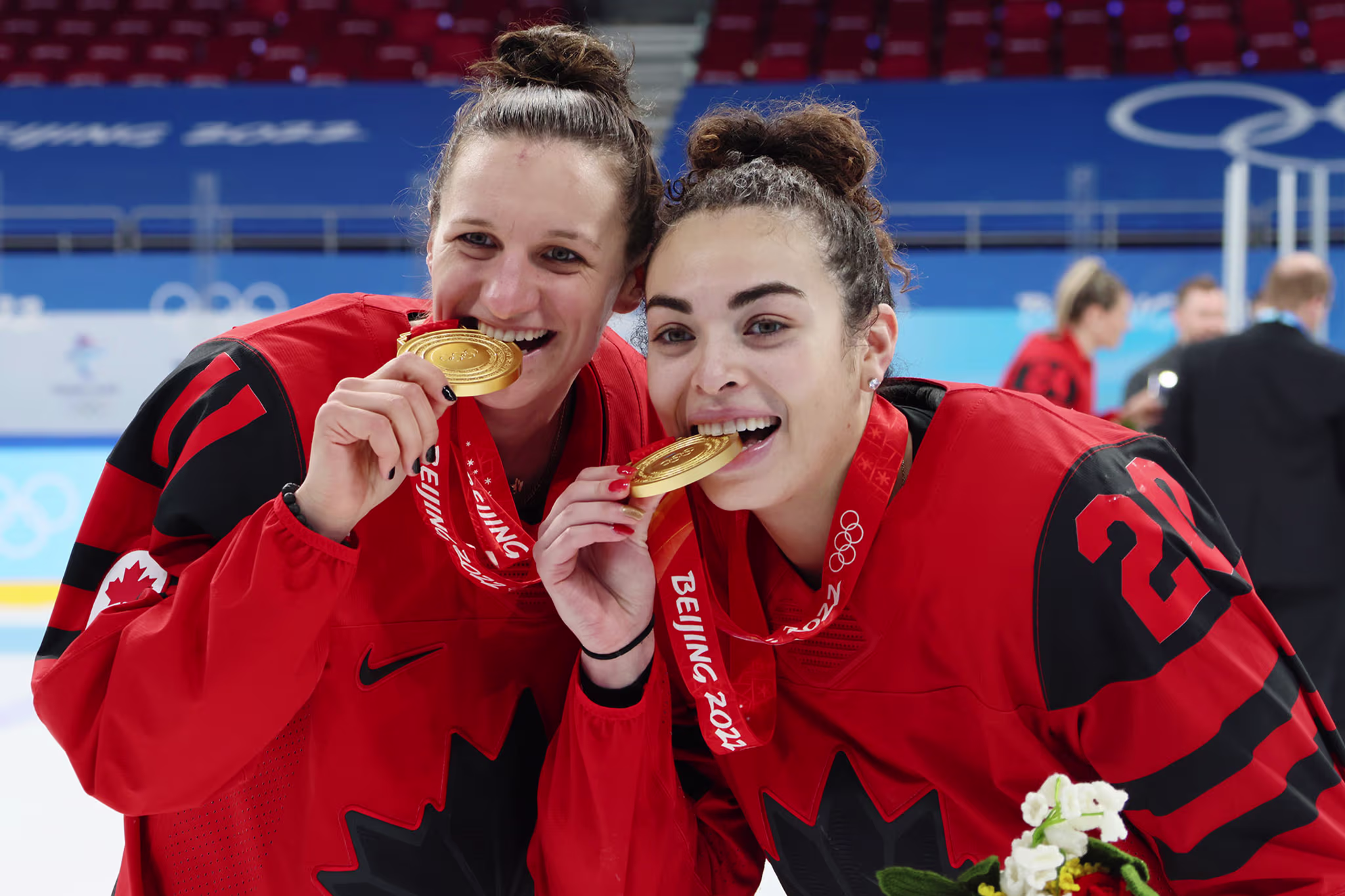 Jill Saulnier #11 and Sarah Nurse #20 of Team Canada pose with their gold medals after the Women's Ice Hockey Gold Medal match