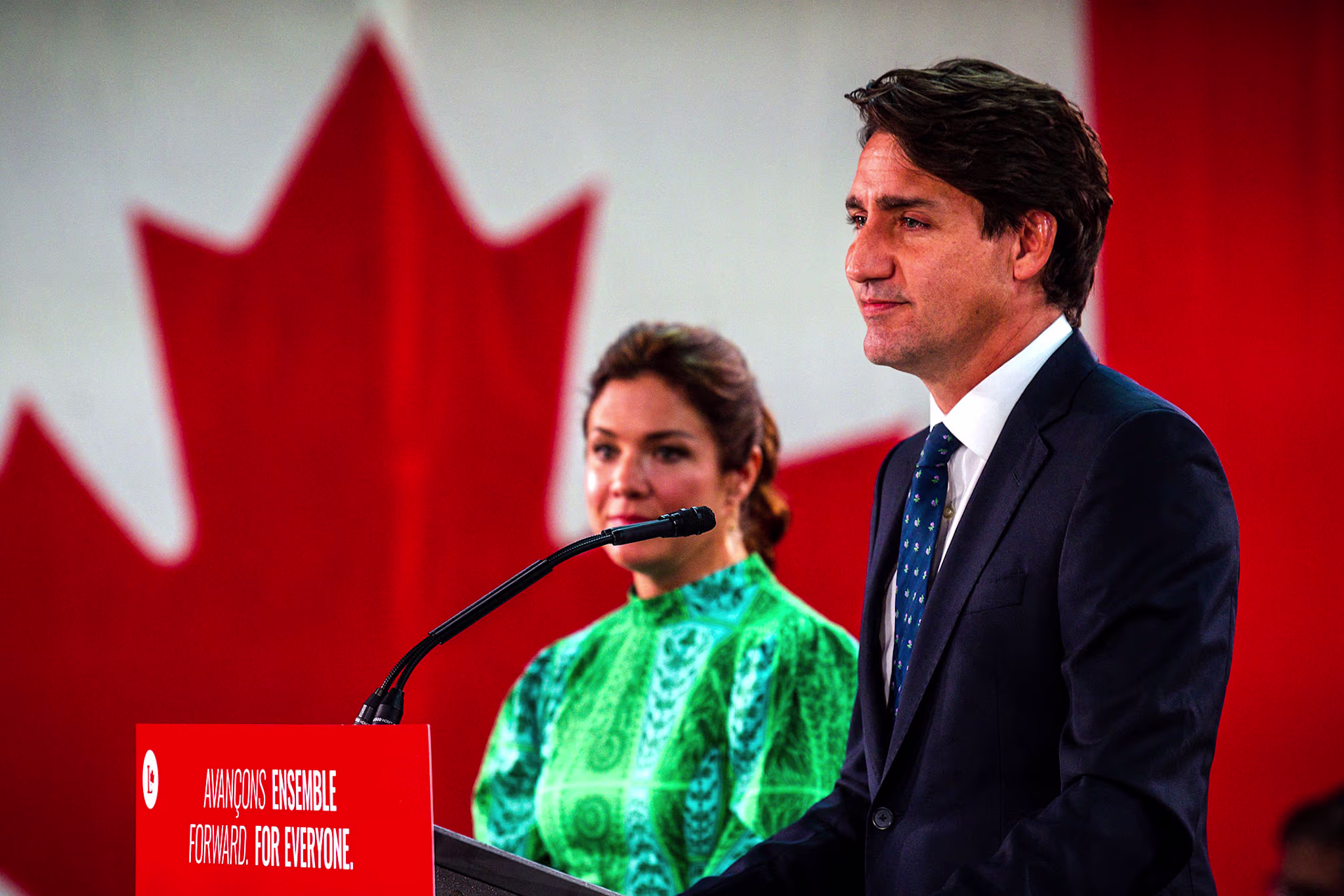 Canadian Prime Minister Justin Trudeau, flanked by wife Sophie Gregoire-Trudea, delivers his victory speech after snap parliamentary elections at the Fairmount Queen Elizabeth Hotel in Montreal, Quebec, early on September 21, 2021.